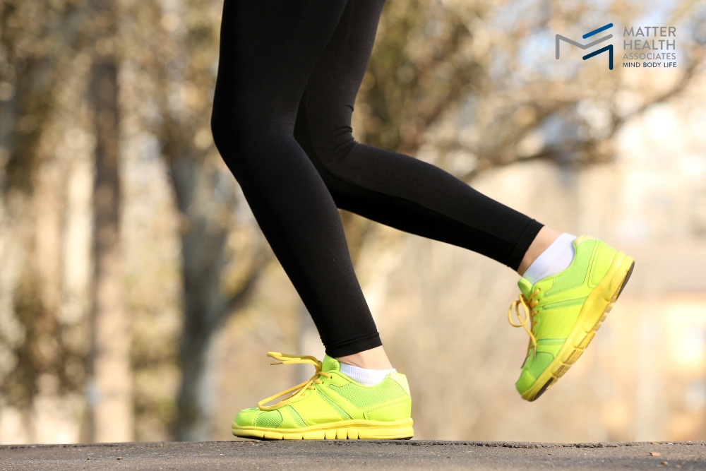 Building a Healthy Future, One Step at a Time | Close-up of feet demonstrating correct walking posture and gait, emphasizing foundational movement for long-term health and pain reduction.