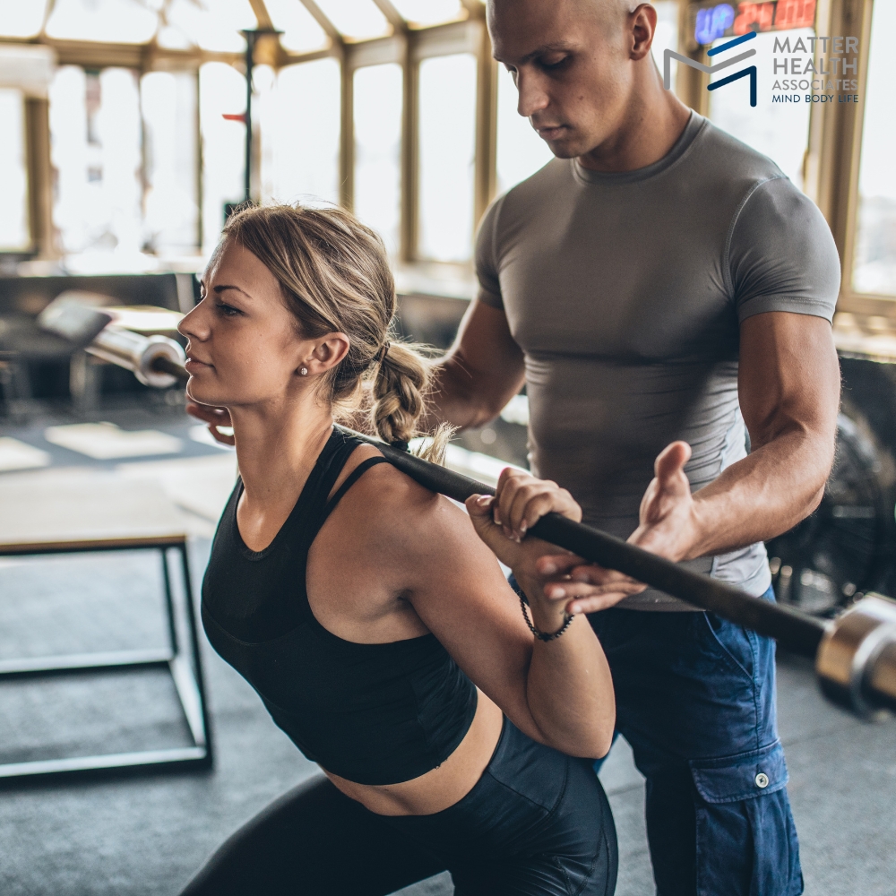 Guiding Through Proper Strength Training Form | Personal trainer coaching correct exercise form for strength training.