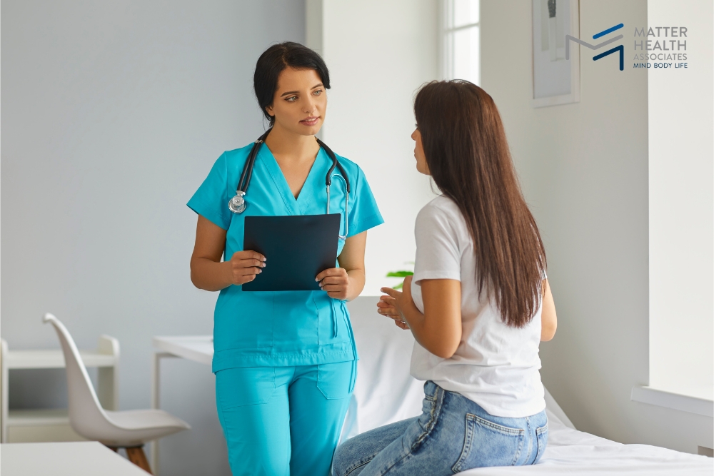 Pain Isn't One-Size-Fits-All How to Understand What Your Body Needs | Healthcare professional attentively listening to a patient during a pain management consultation at MHA clinic.