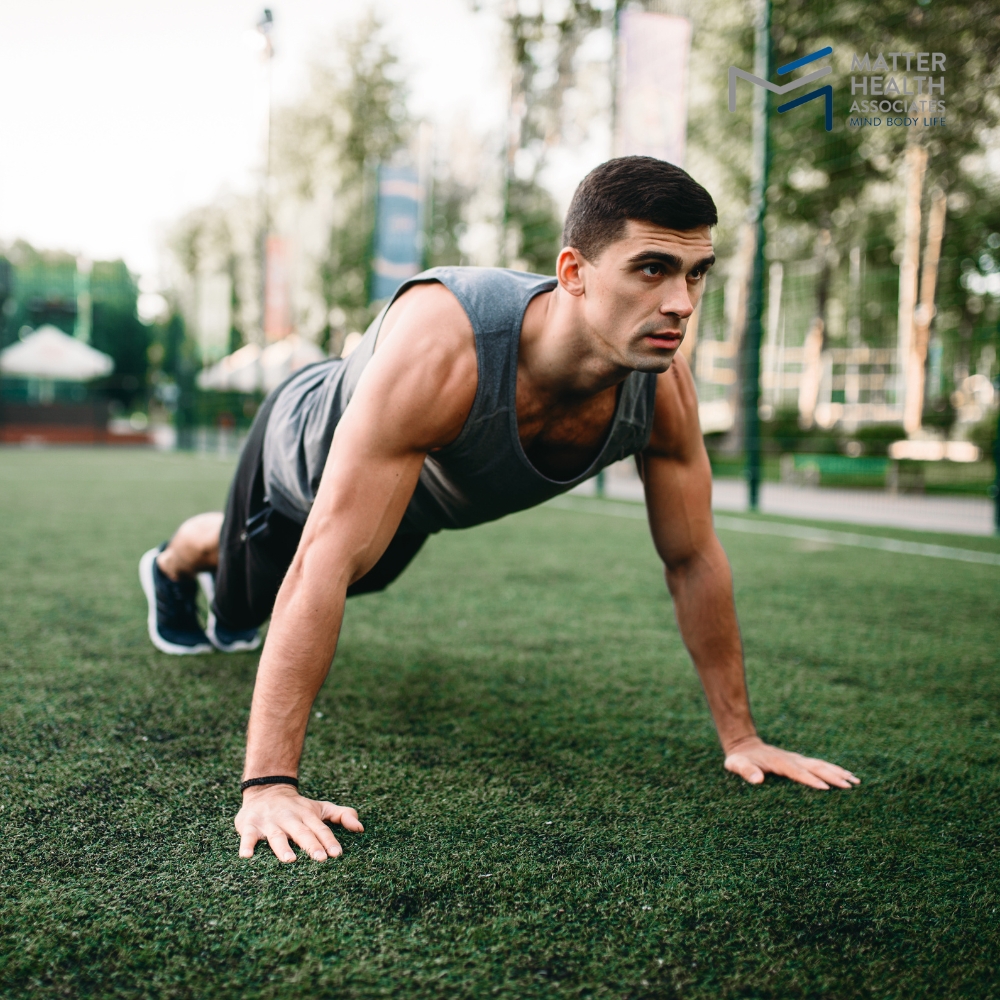 Redefining Fitness Embracing Outdoor and At-Home Workouts | Person exercising outdoors in a peaceful setting, showing alternative ways to stay fit without going to the gym.