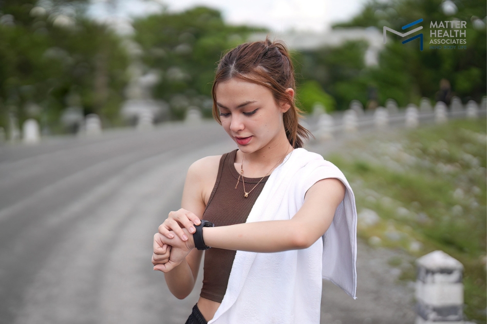 Using Fitness Apps to Build Healthy Habits | A person using a fitness app open, showing a step counter and calorie tracker.