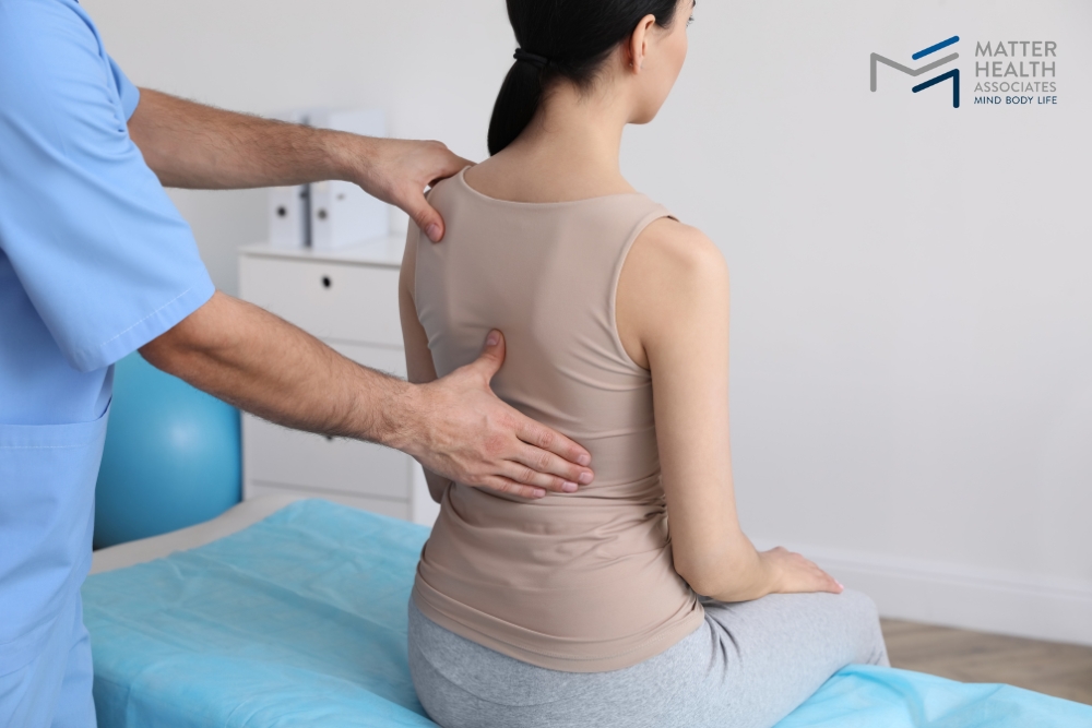 Your Pain, Your Plan Taking the First Step Toward Lasting Relief | Chiropractor performing a gentle spinal adjustment on a patient to alleviate back pain at MHA clinic.
