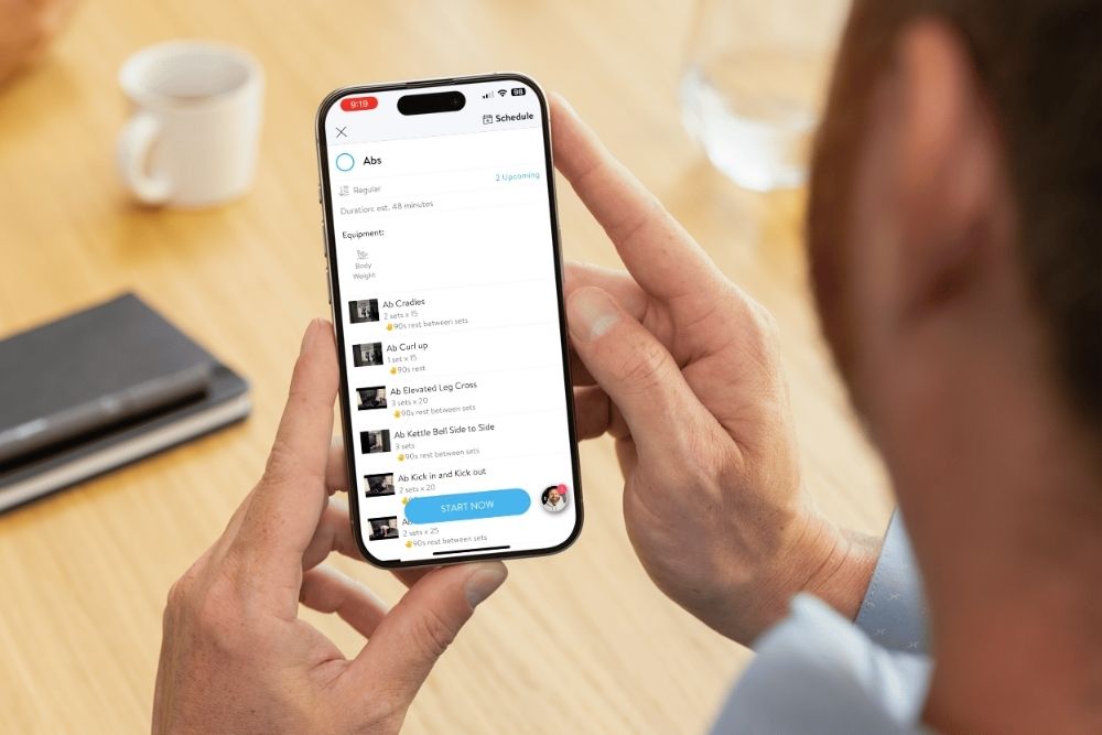 close up image of a phone showing the MHA app interface