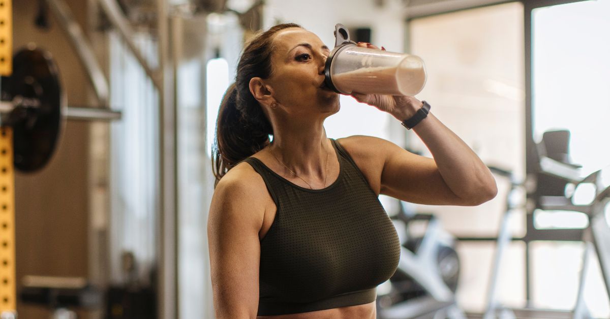 Woman enjoying a protein shake as part of a healthy lifestyle to boost metabolism