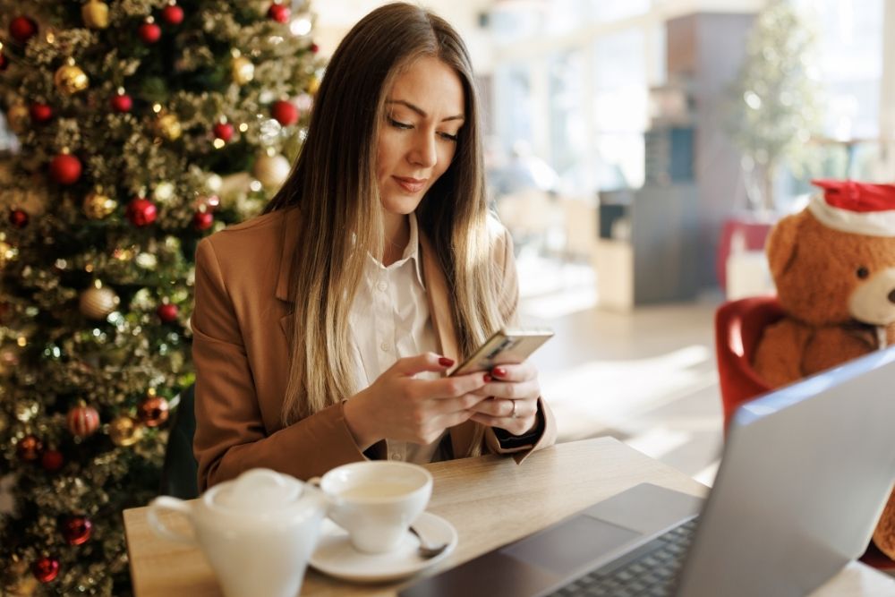 A woman using her phone to check the MHA app