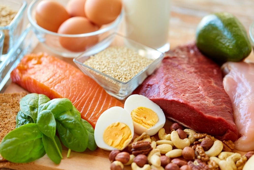A variety of whole protein foods like fish and eggs that offer superior nutrition compared to processed protein powder.