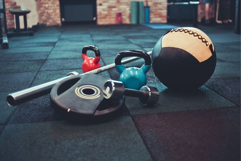 Photos of gym equipment representing a consistent and sustainable fitness routine.