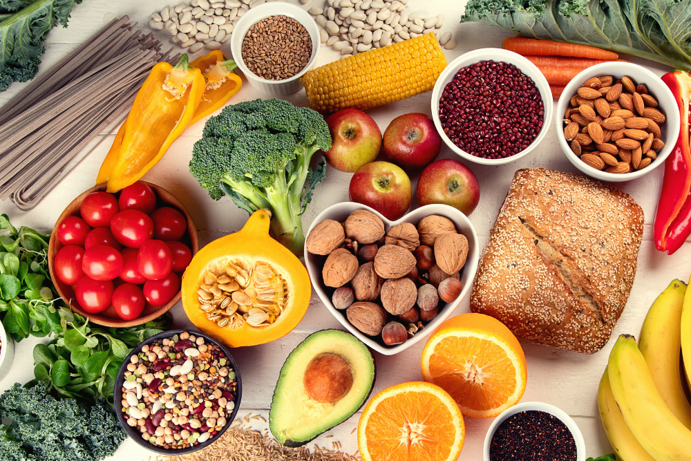 Variety of fresh, whole food ingredients that form the foundation of nutrition basics.