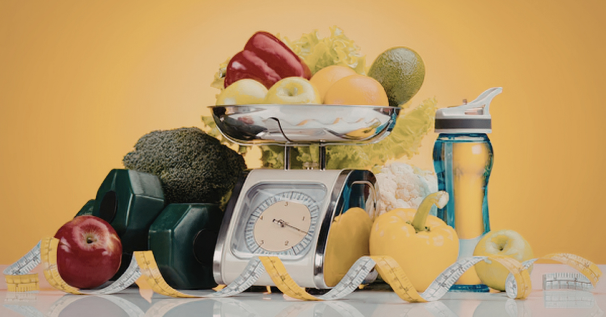 Balanced healthy foods with water and a weighing scale on a clean table.
