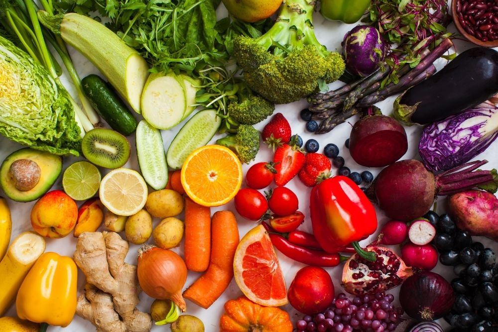 A colorful arrangement of raw vegetables and whole ingredients, highlighting the different roles of functional fuel.