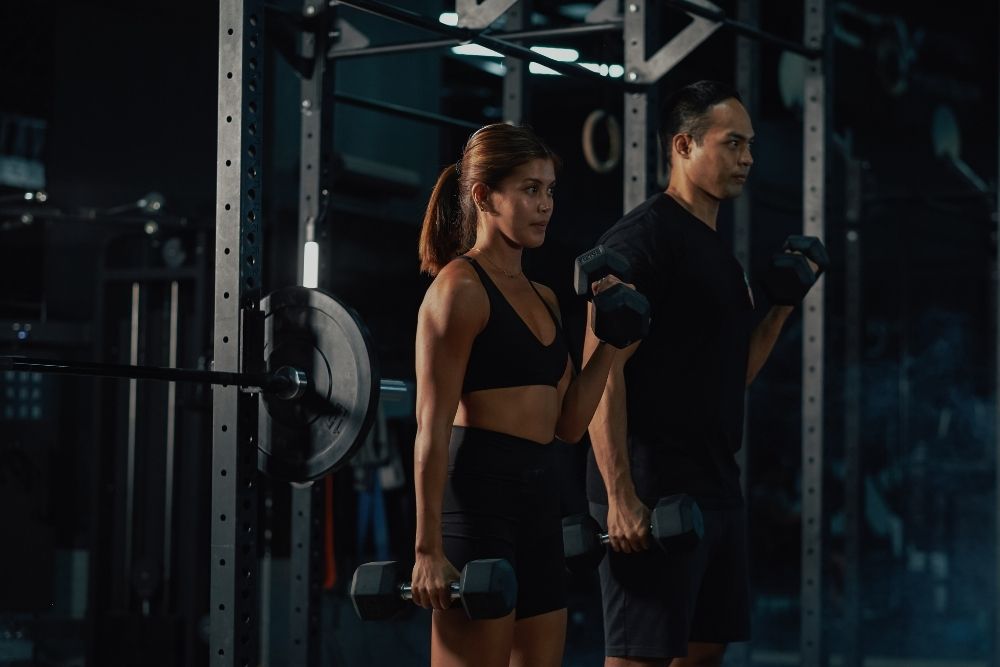 Individuals performing GLP-1s and resistance training exercises to build strength and maintain lean muscle