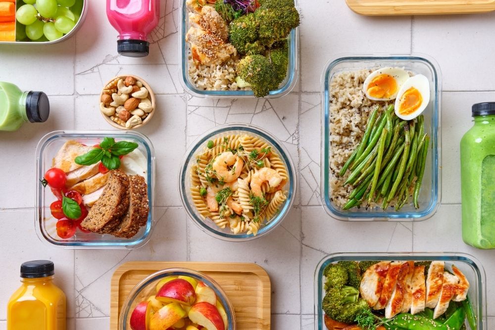 Balanced meal prep containers with healthy proteins and vegetables to support nutrition