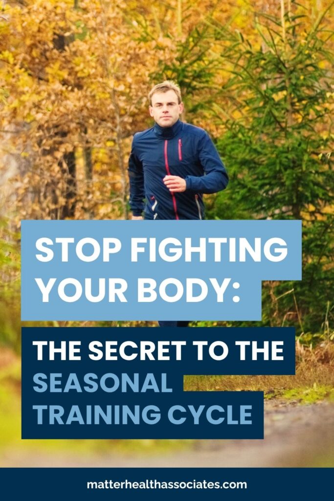 a male runner in a forest during fall with text, "STOP FIGHTING YOUR BODY: THE SECRET TO THE SEASONAL TRAINING CYCLE."