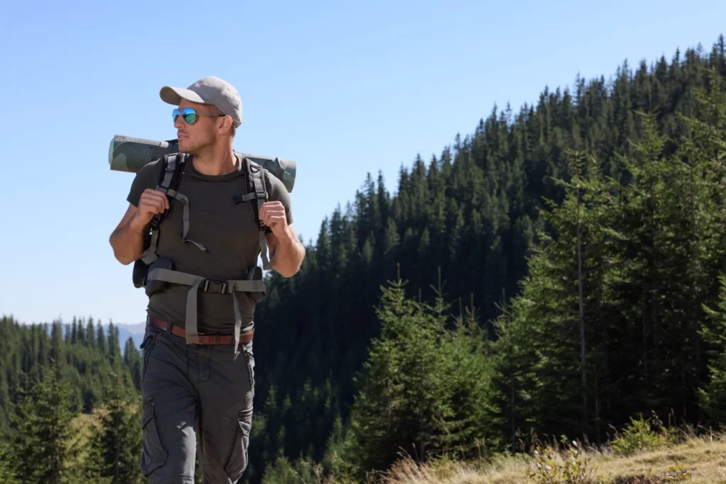 Backcountry hunter with a loaded pack in the mountains, ready for an elk hunt